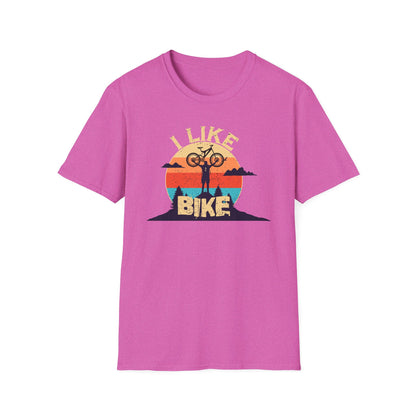 I like bike graphic t-shirt depicting a person holding a bike over their head on top of a hill with a retro sun in the background, shirt color pink.