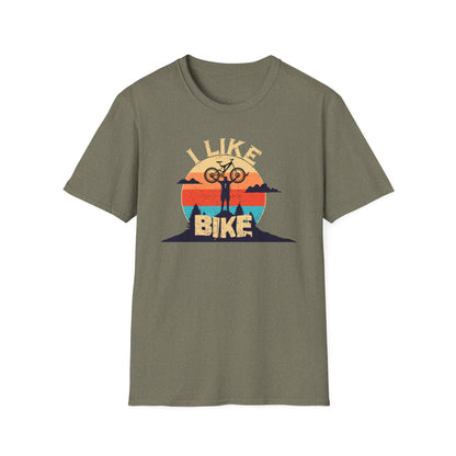 I like bike graphic t-shirt depicting a person holding a bike over their head on top of a hill with a retro sun in the background, shirt color heather military green.