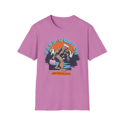 Pink Sass-quatch graphic t-shirt showing a stylish Big Foot walking by a mountain stream.