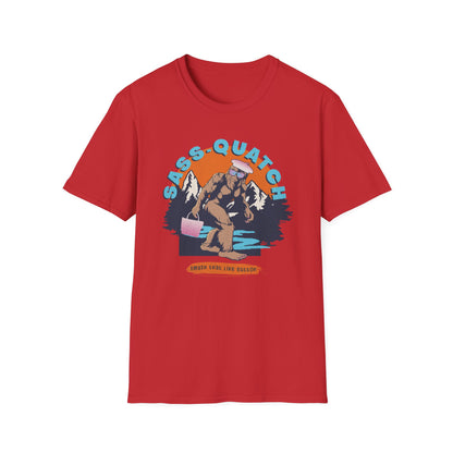 Red Sass-quatch graphic t-shirt showing a stylish Big Foot walking by a mountain stream.