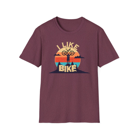 I like bike graphic t-shirt depicting a person holding a bike over their head on top of a hill with a retro sun in the background, shirt color heather maroon.